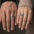 Load image into Gallery viewer, Oxidized sterling silver protective eye ring worn on the finger, lifestyle image presenting bold contrast, mystical symbolism, and a strong statement profile.
