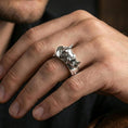 Load image into Gallery viewer, Sterling silver rhino head ring worn on a finger, polished silver finish delivering a clean reflective surface and crisp sculpted definition.
