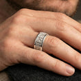 Load image into Gallery viewer, Gothic fleur-de-lis band ring worn on a finger, polished silver finish with clean highlights and a refined classic look.
