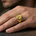 Load image into Gallery viewer, Gold plated Spartan signet ring worn on a finger, lifestyle image emphasizing warm tone and bold warrior statement style
