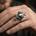 Load image into Gallery viewer, Oxidized demon skull ring worn on a finger, close-up lifestyle photo highlighting the broken horns and skull depth
