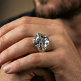 Load image into Gallery viewer, Polished silver compass signet ring on the finger, wearable photo emphasizing the crisp eight-point star and engraved letters

