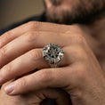 Load image into Gallery viewer, Oxidized compass ring worn on a finger, lifestyle close-up highlighting the raised star, bezel depth, and directional markers

