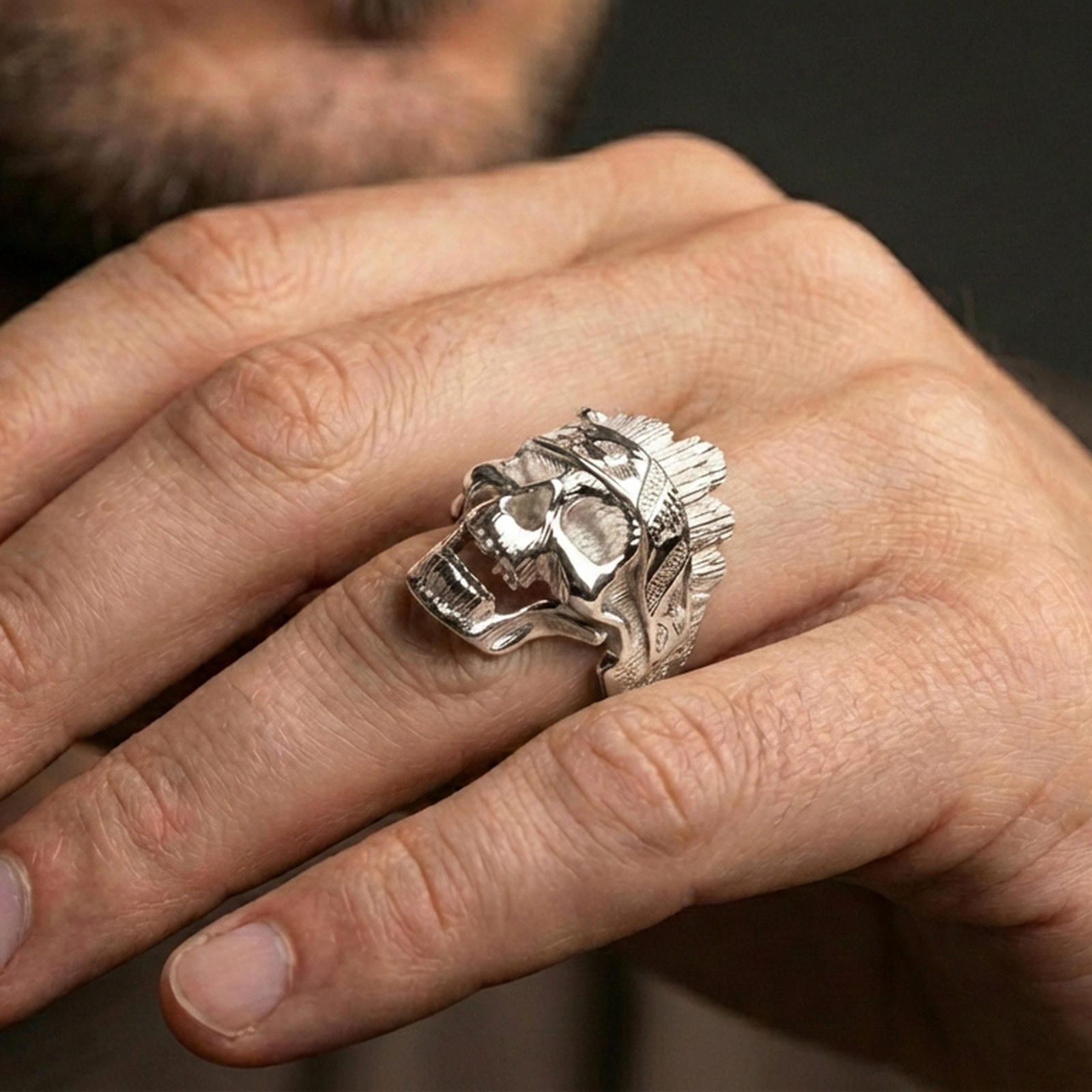 Polished silver tree bark skull ring on the finger, wearable close-up showing detailed texture carving and bold skull profile