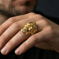 Load image into Gallery viewer, Gold plated bearded skull ring worn on a finger, close-up lifestyle image showcasing the carved hair and beard relief
