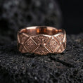 Load image into Gallery viewer, Rose gold plated sterling silver ornament band on volcanic stone, intricate engraved diamond panels with deep contrast, minimal high-end close-up.
