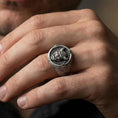 Load image into Gallery viewer, Oxidized seigaiha wave oni mask ring worn on a finger, close-up lifestyle shot highlighting the horned demon face and engraved pattern
