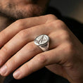 Load image into Gallery viewer, Polished silver Lucifer sigil ring on the finger, macro lifestyle image emphasizing the sharp relief lines and smooth signet profile
