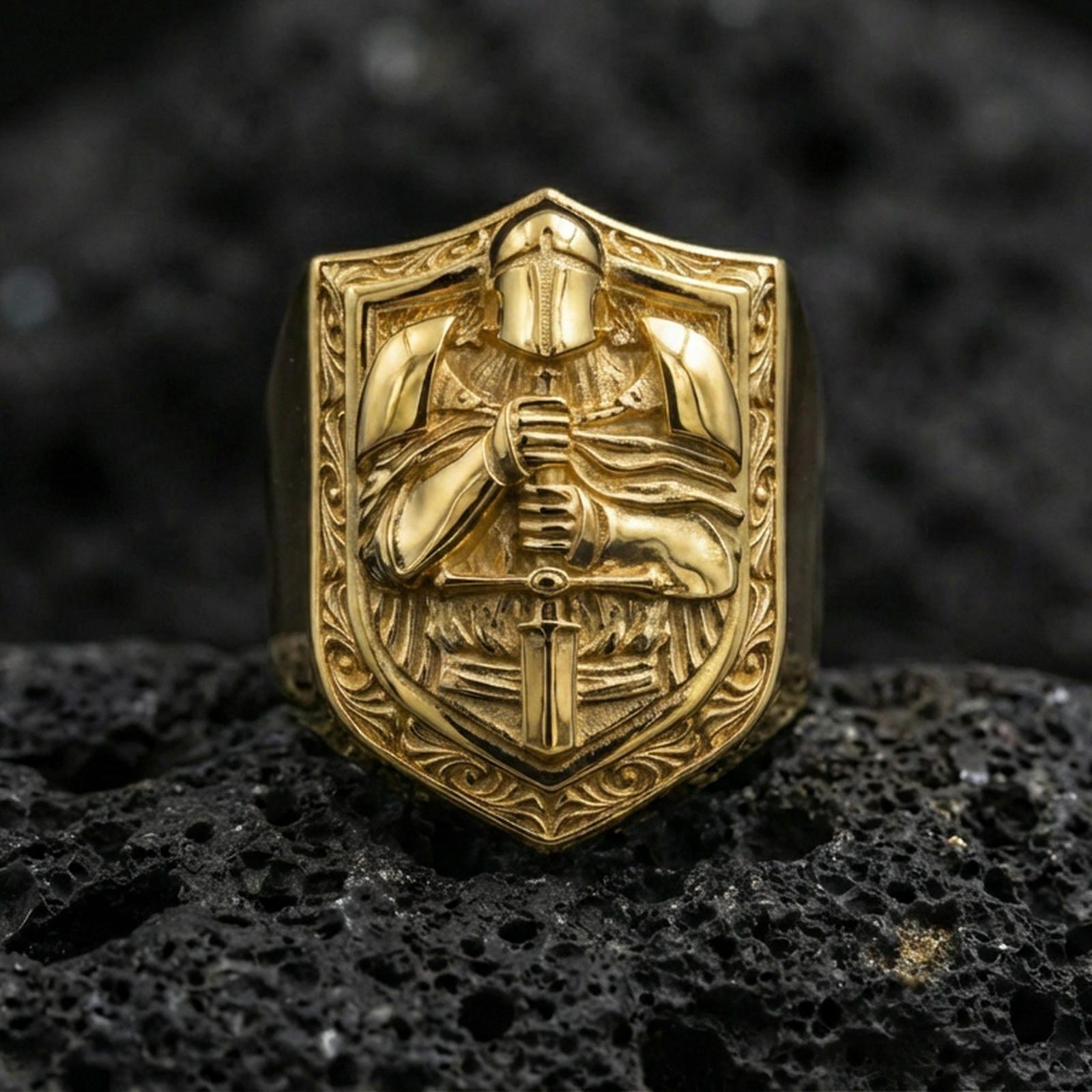 Sterling silver knight signet ring with a gold plated finish, shield crest with armored warrior holding a sword, detailed engraving on black volcanic rock