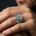 Load image into Gallery viewer, Polished silver finish double-headed eagle Masonic ring on the finger, macro lifestyle image showing the ornate side engraving and crisp emblem details
