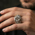 Load image into Gallery viewer, Polished silver steampunk skull statement ring on finger, crisp skull relief and textured band detail, refined everyday wear close-up.
