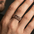 Load image into Gallery viewer, Rose gold plated Cuban link band ring worn on finger, bold chain link relief with engraved detail, elegant lifestyle wear shot.
