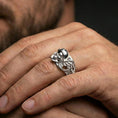 Load image into Gallery viewer, Polished silver gothic biker skull statement ring on finger, crisp skull relief and mechanical wing detail, refined everyday wear close-up.
