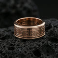 Load image into Gallery viewer, Rose gold plated sterling silver Greek key band on volcanic stone, sharp geometric meander engraving with refined edges, minimal high-end close-up.
