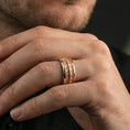 Load image into Gallery viewer, Rose gold plated lizard scale spinner ring worn on finger, bold textured reptile pattern detail, elegant lifestyle wear shot.
