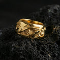 Load image into Gallery viewer, Gold plated roots wedding band ring on volcanic rock, detailed organic vine pattern with rugged bark texture, luxury jewelry product photography.
