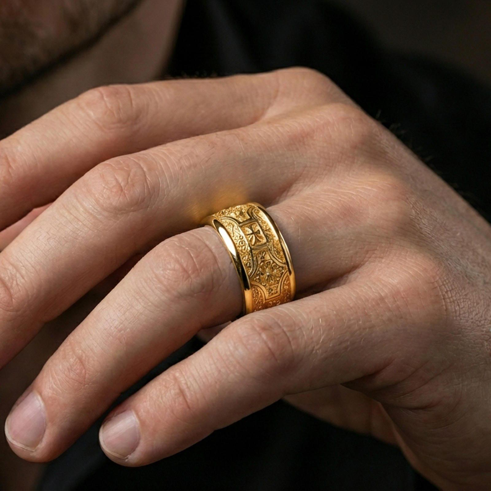 Gold plated ornate filigree band worn on finger, detailed floral centerpiece with vintage scrollwork, premium lifestyle jewelry photo.