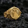 Load image into Gallery viewer, Sterling silver eye and pyramid ring with a gold plated finish, symbolic occult-style signet design with detailed side engravings, macro on volcanic rock
