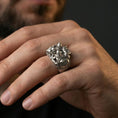Load image into Gallery viewer, Sterling silver Spartan warrior ring worn on a finger, close-up lifestyle shot highlighting the oxidized high-relief Greek battle scene and shield detail
