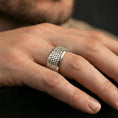 Load image into Gallery viewer, Polished silver textured scale band ring on finger, crisp repeating scale pattern and smooth edges, refined everyday wear close-up.
