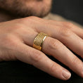 Load image into Gallery viewer, Gold plated scale texture band worn on finger, detailed repeating scale pattern, premium lifestyle jewelry photo.
