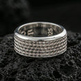 Load image into Gallery viewer, Polished silver textured scale band ring on black volcanic stone, crisp repeating scale pattern and smooth comfort edges, centered close-up studio lighting.
