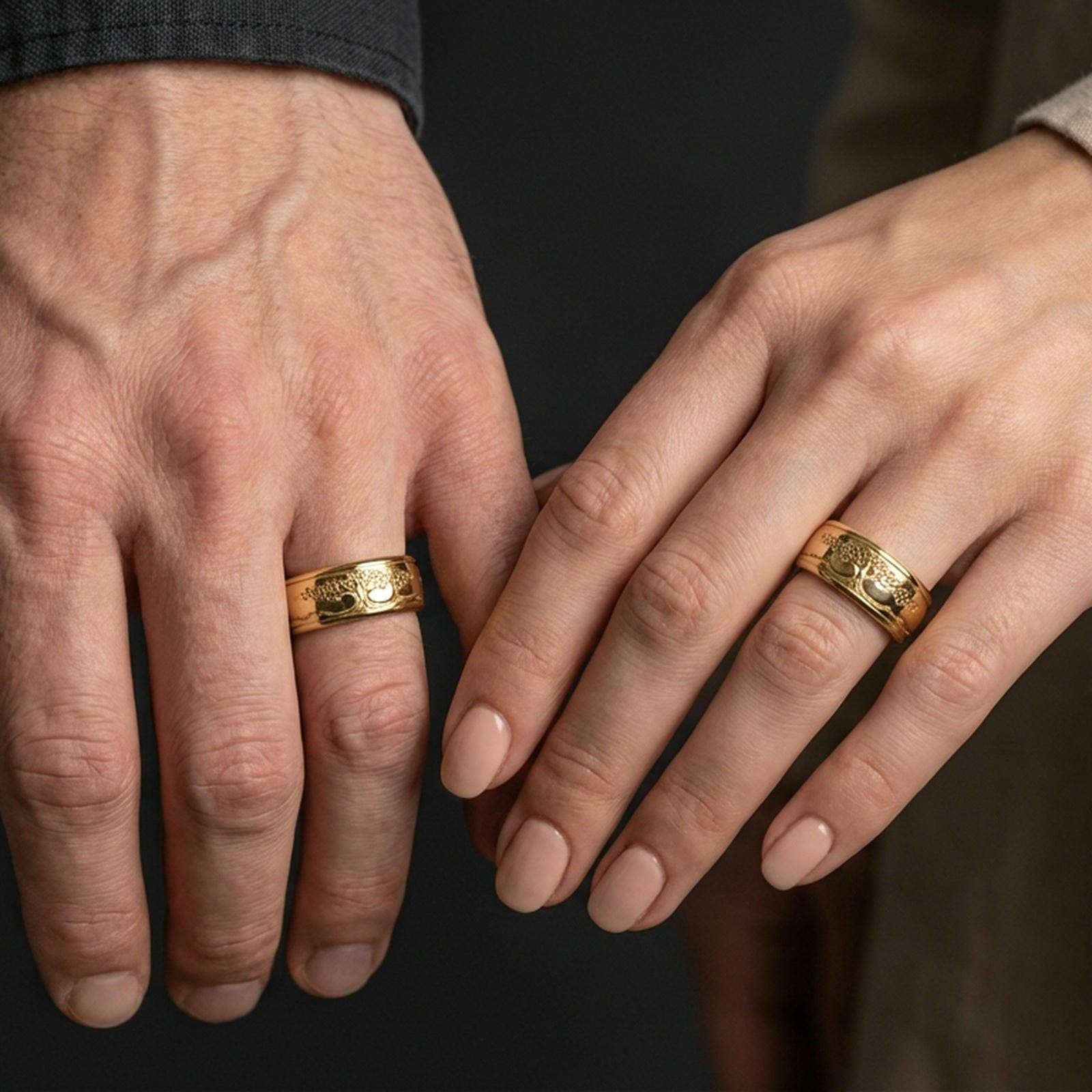 Rose gold plated Yggdrasil spinner ring worn on finger, sculpted tree of life engraving detail, elegant lifestyle wear shot.
