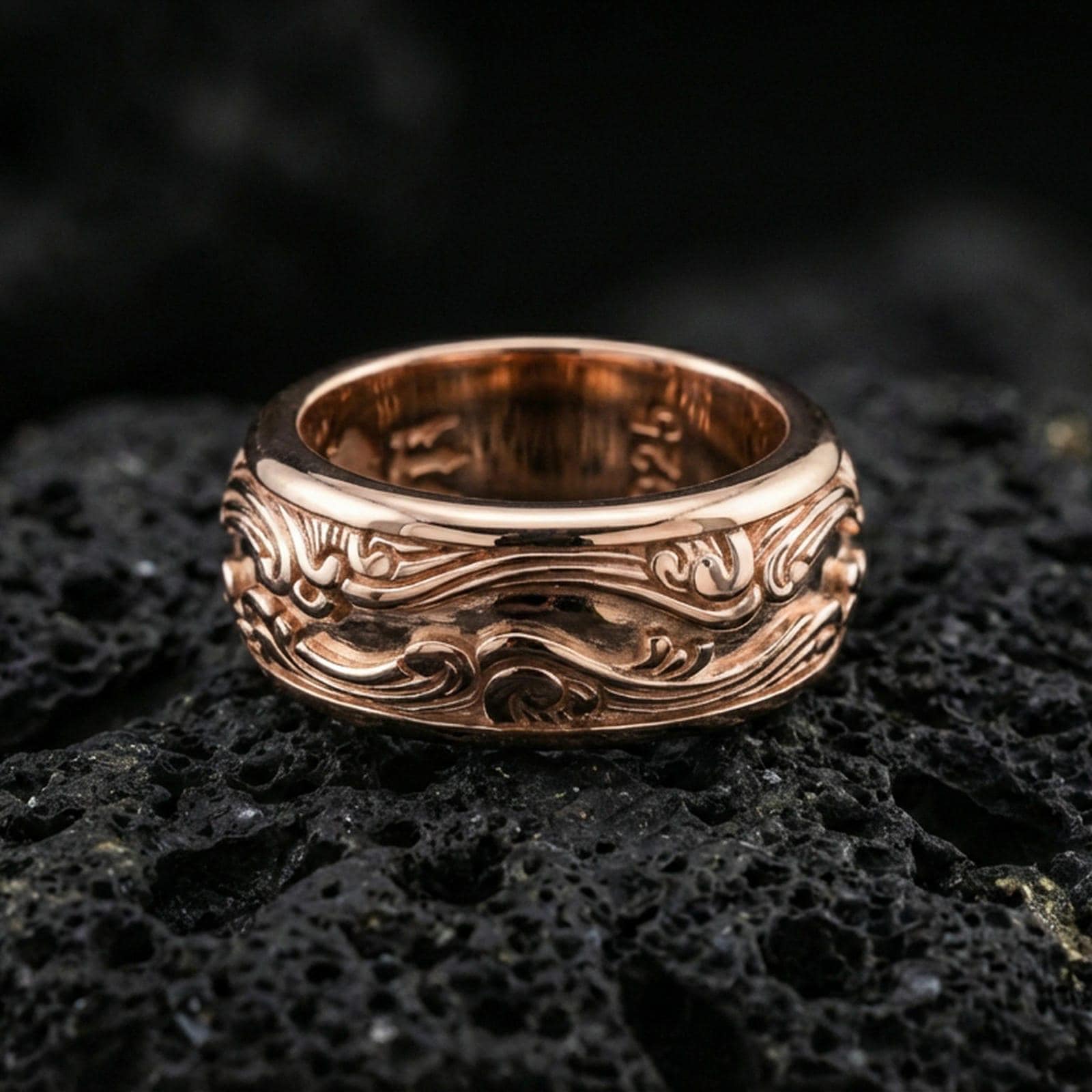 Rose gold plated sterling silver wave filigree spinner ring on volcanic stone, ornate swirl relief with deep contrast and clean borders, minimal high-end close-up.