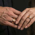 Load image into Gallery viewer, Rose gold plated wave filigree spinner ring worn on finger, ornate swirl relief detail, elegant lifestyle wear shot.
