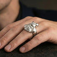 Load image into Gallery viewer, Sterling silver Japanese warrior helmet ring on a finger, macro lifestyle image emphasizing the polished silver finish and sculpted samurai mask details
