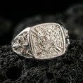 Load image into Gallery viewer, Sterling silver Crusader signet ring in a polished silver finish, detailed Templar-style heraldic shield with cross motifs and medieval engraving, close-up on volcanic stone
