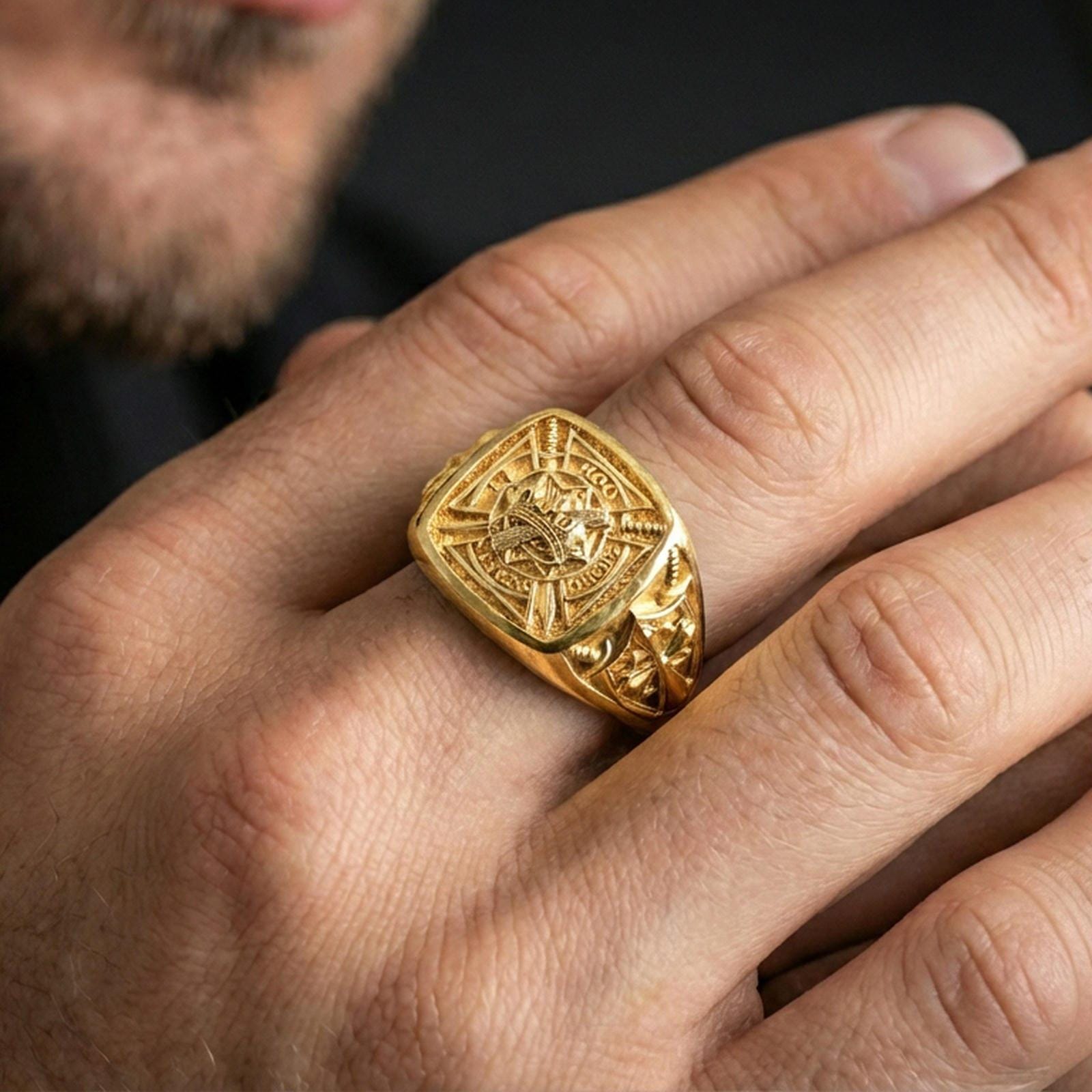 Sterling silver medieval knight statement ring worn on a finger, close-up lifestyle photo showcasing the gold plated finish and Templar-inspired heraldic shield motif