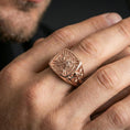 Load image into Gallery viewer, Sterling silver Templar symbolism ring on a finger, macro lifestyle shot featuring the rose gold plated finish and ornate crusader cross side detailing
