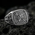 Load image into Gallery viewer, Sterling silver Templar shield ring with an oxidized finish, engraved crusader cross, crown and sword emblem with Latin inscription, macro on black volcanic rock
