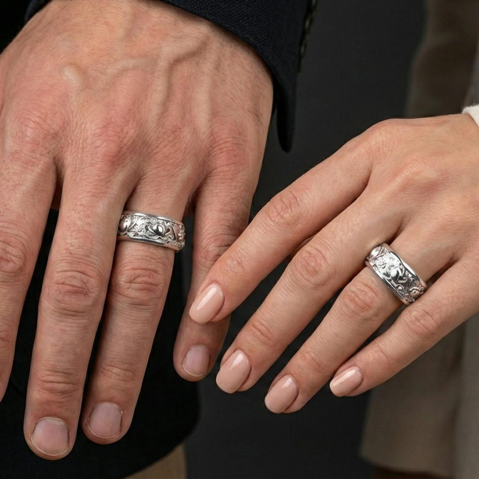 Polished silver lotus fidget spinner ring on finger, crisp lotus blossom relief and smooth edges, refined everyday wear close-up.