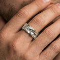 Load image into Gallery viewer, Polished silver Moses fidget spinner ring on finger, crisp face relief and ornamental side detail, refined everyday wear close-up.
