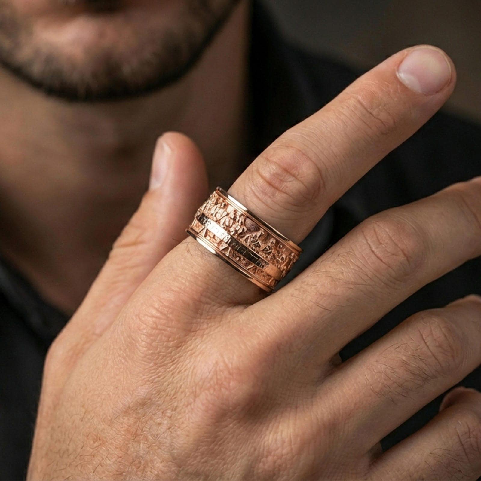 Rose gold plated Last Supper band ring worn on finger, sculpted apostle scene relief detail, elegant lifestyle wear shot.