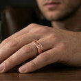 Load image into Gallery viewer, Rose gold plated minimalist floral engraved ring worn on finger, refined warm glow with clear scrollwork definition and smooth edges.

