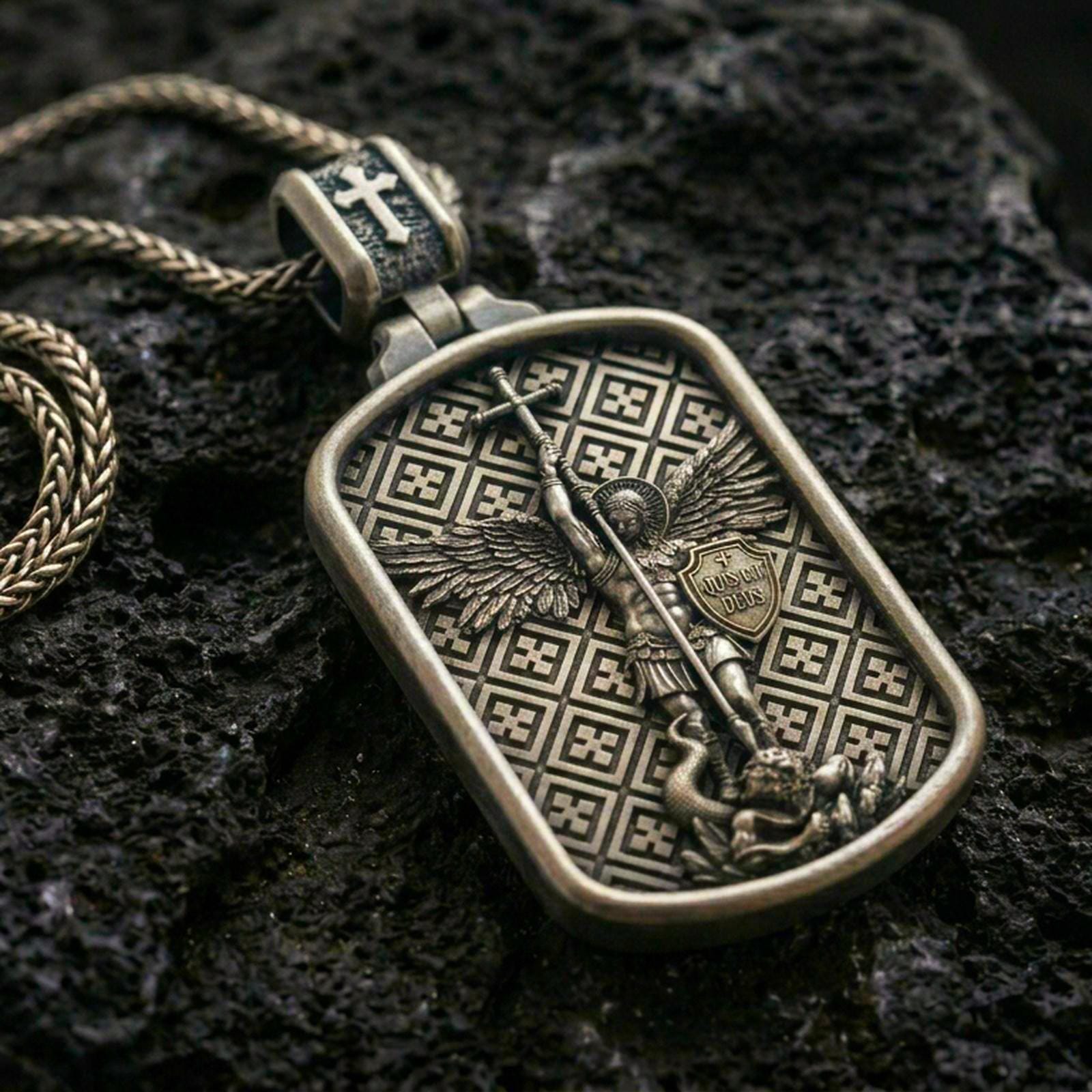 Saint Michael dog tag pendant on black volcanic stone with bronze material, showing the archangel with spear and shield.