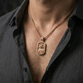 Load image into Gallery viewer, Rose gold plated Jesus devotional pendant with Sacred Heart design worn on the neck in a refined lifestyle shot with a warm and elegant presentation
