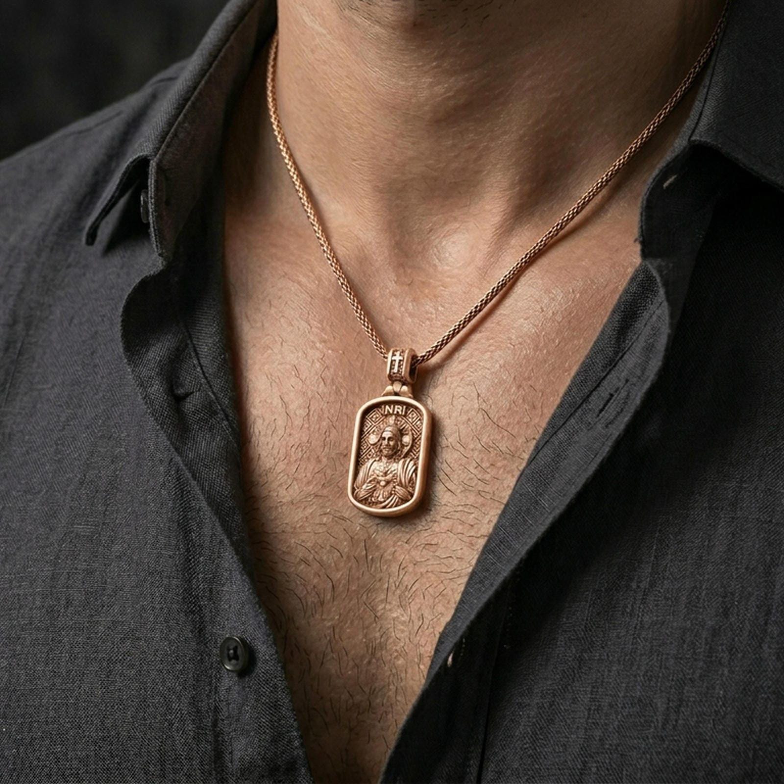 Rose gold plated Jesus devotional pendant with Sacred Heart design worn on the neck in a refined lifestyle shot with a warm and elegant presentation