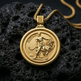 Load image into Gallery viewer, Gold plated Lion of Judah medallion pendant with circular rotating design, lion symbol, and Judah lettering showcased on black volcanic rock in a refined macro jewelry image
