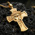 Load image into Gallery viewer, Gold plated Jesus cross pendant with INRI detail, expressive face relief, and crucifix form showcased on black volcanic rock in a refined macro jewelry image
