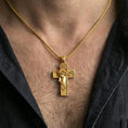 Load image into Gallery viewer, Gold plated Jesus crucifix pendant with portrait relief and cross design worn on the neck in a premium lifestyle composition with classic Christian jewelry styling
