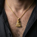 Load image into Gallery viewer, Sterling silver Khnum pendant worn on the neck, close-up lifestyle photo featuring the gold plated finish and ram-headed Egyptian spiritual symbol
