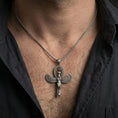 Load image into Gallery viewer, Sterling silver Egyptian Isis winged pendant necklace worn on the neck, close-up lifestyle shot highlighting the oxidized finish and feather wing details
