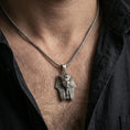 Load image into Gallery viewer, Sterling silver pharaoh head pendant necklace worn on the neck, close-up lifestyle shot highlighting the oxidized finish and engraved headdress texture
