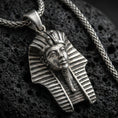Load image into Gallery viewer, Sterling silver pharaoh head pendant with an oxidized finish, detailed Egyptian headdress and face relief, close-up on black volcanic rock
