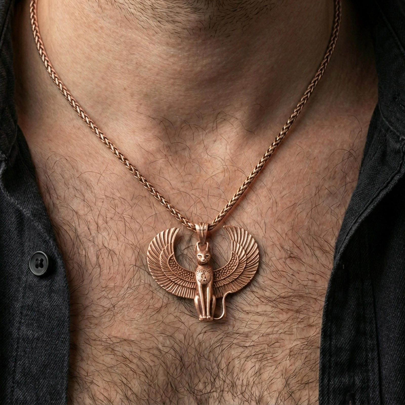 Sterling silver winged Bastet pendant necklace on the neck, macro lifestyle shot showcasing the rose gold plated finish and Egyptian-inspired cat design
