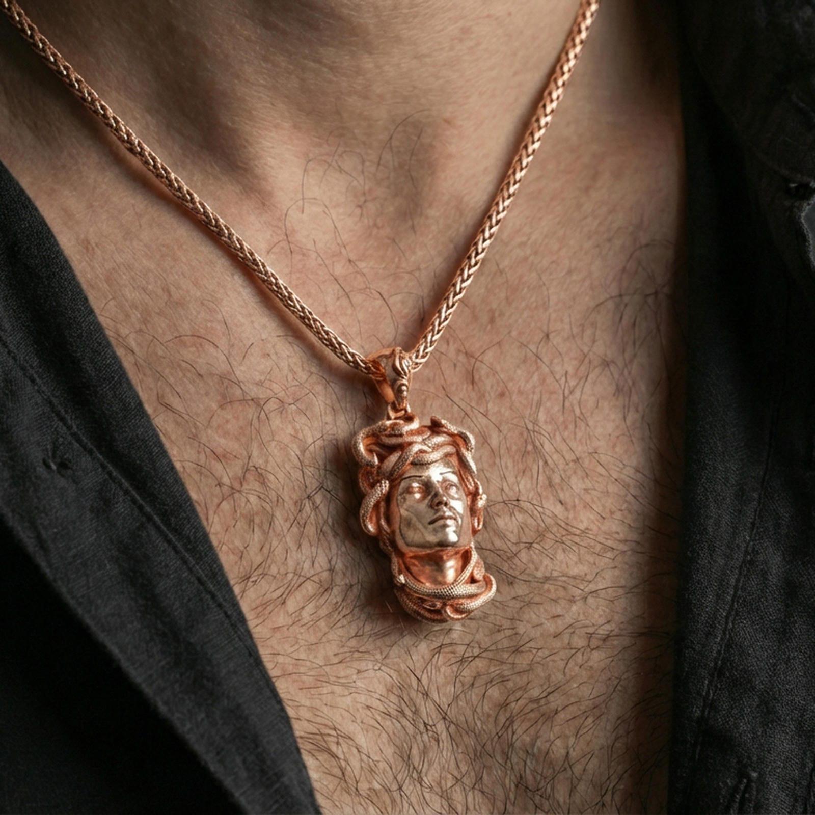Rose gold plated Medusa head pendant necklace worn on the neck, lifestyle wear shot featuring soft warm metallic glow and detailed serpent crown definition.